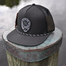 Black Skully rope trucker hat from Blueline Surf & Paddle Co. featuring custom skull artwork and lightweight coastal styling inspired by the Jupiter Florida saltwater lifestyle.