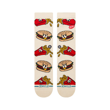 A pair of crew socks in a warm off-white/cream color, featuring a colorful cartoon pattern of burgers & french fries.