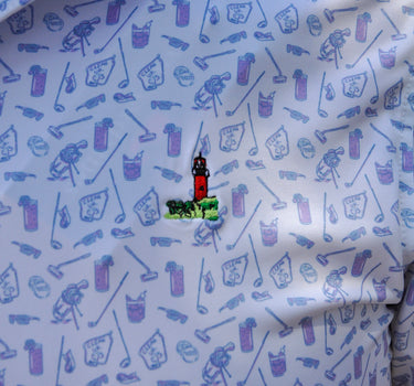 Close-up pattern detail of Vineyard Vines x Blueline Performance Lighthouse Polo featuring lightweight breathable coastal performance fabric.
