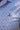 Close-up pattern detail of Vineyard Vines x Blueline Performance Lighthouse Polo featuring lightweight breathable coastal performance fabric.
