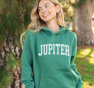 Model wearing the Women's Jupiter Florida Hoodie in Heather Forest from Blueline Surf & Paddle Co.