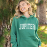 Model wearing the Women's Jupiter Florida Hoodie in Heather Forest from Blueline Surf & Paddle Co.