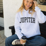 Model wearing the Women's Jupiter Florida Hoodie in White Heather from Blueline Surf & Paddle Co.
