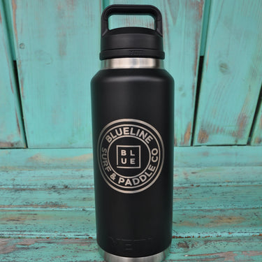 YETI x Blueline 46 oz black chug bottle with Blueline Surf & Paddle Co logo.