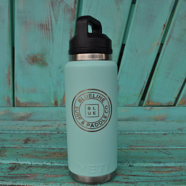 YETI x Blueline 46 oz seafoam chug bottle with Blueline Surf & Paddle Co logo.